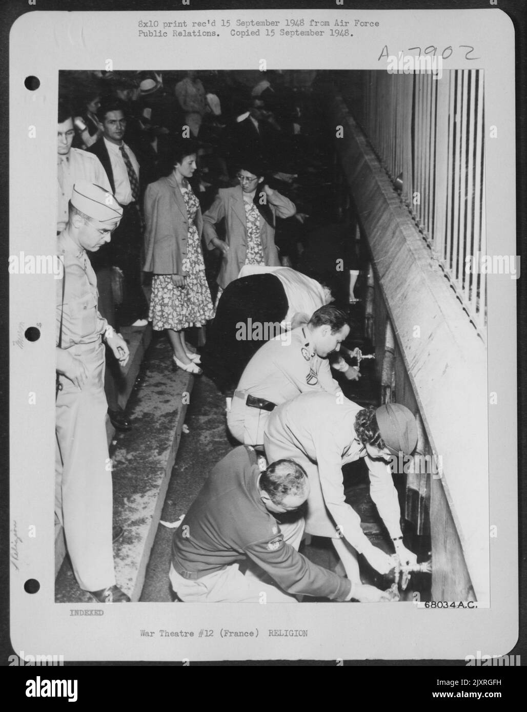 At The Grotto Spring In Lourdes Where Water Sprang From A Rock When The Visions Of The Virgin May Is Believed To Have Appeared Before St. Bernadette, Us Air Force In Europe Pilgrims, Who Participated With 7 Other Nations In Three-Day Ceremonies Honoring F Stock Photo