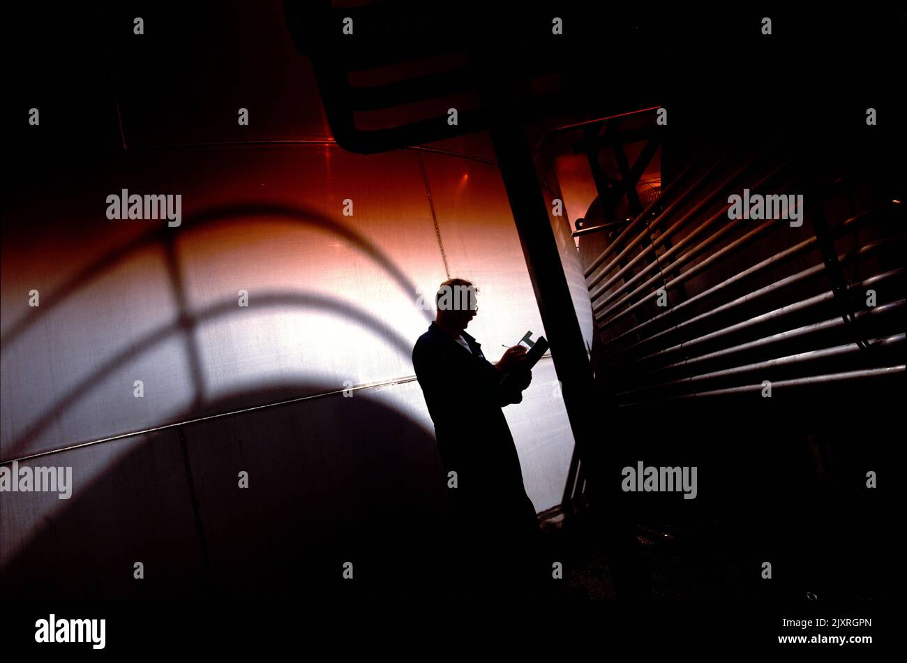 Working with Storage tanks Stock Photo - Alamy