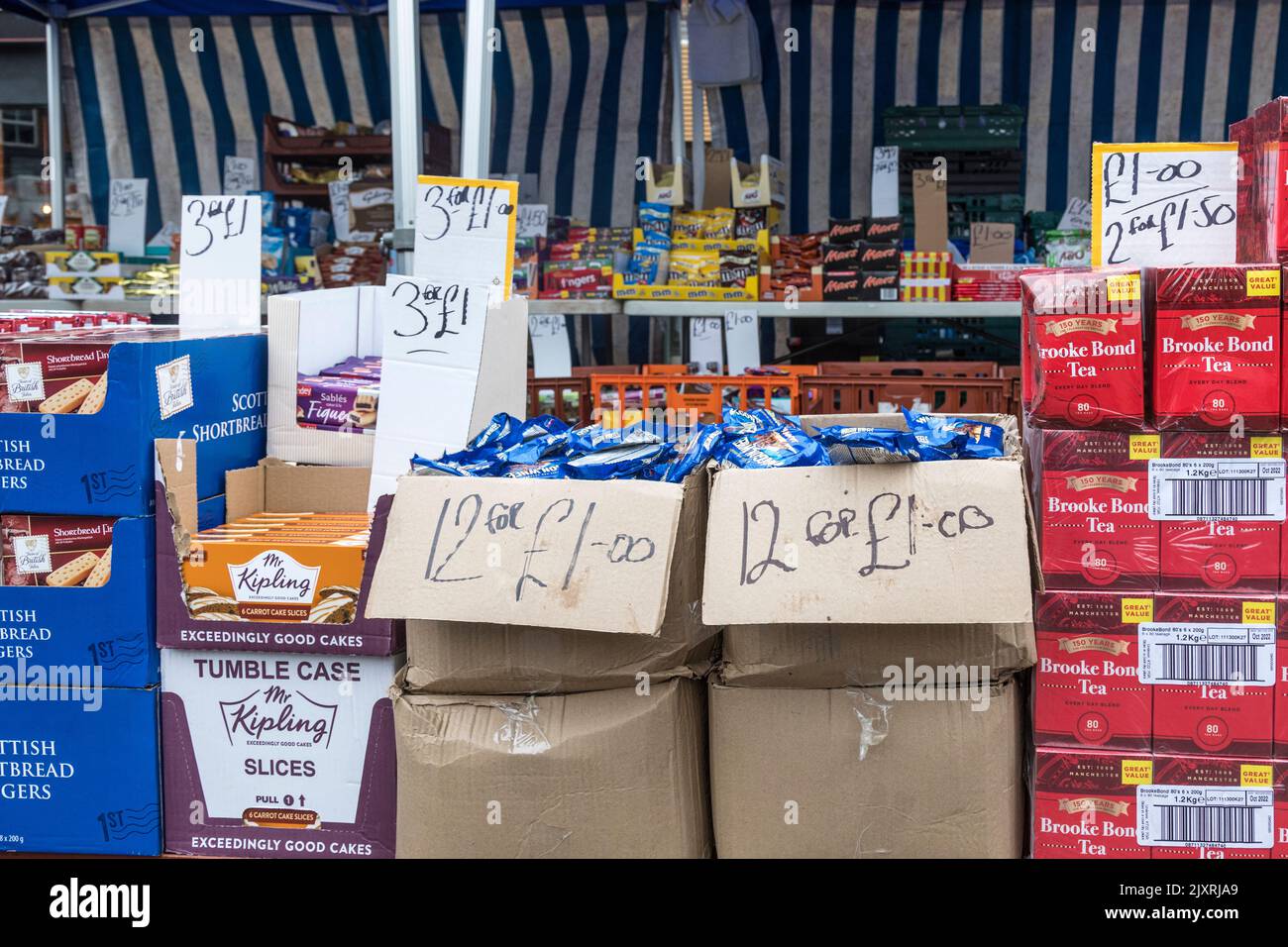 Boxes of food priced for selling on a market stall, Loughborough, England. Stock Photo