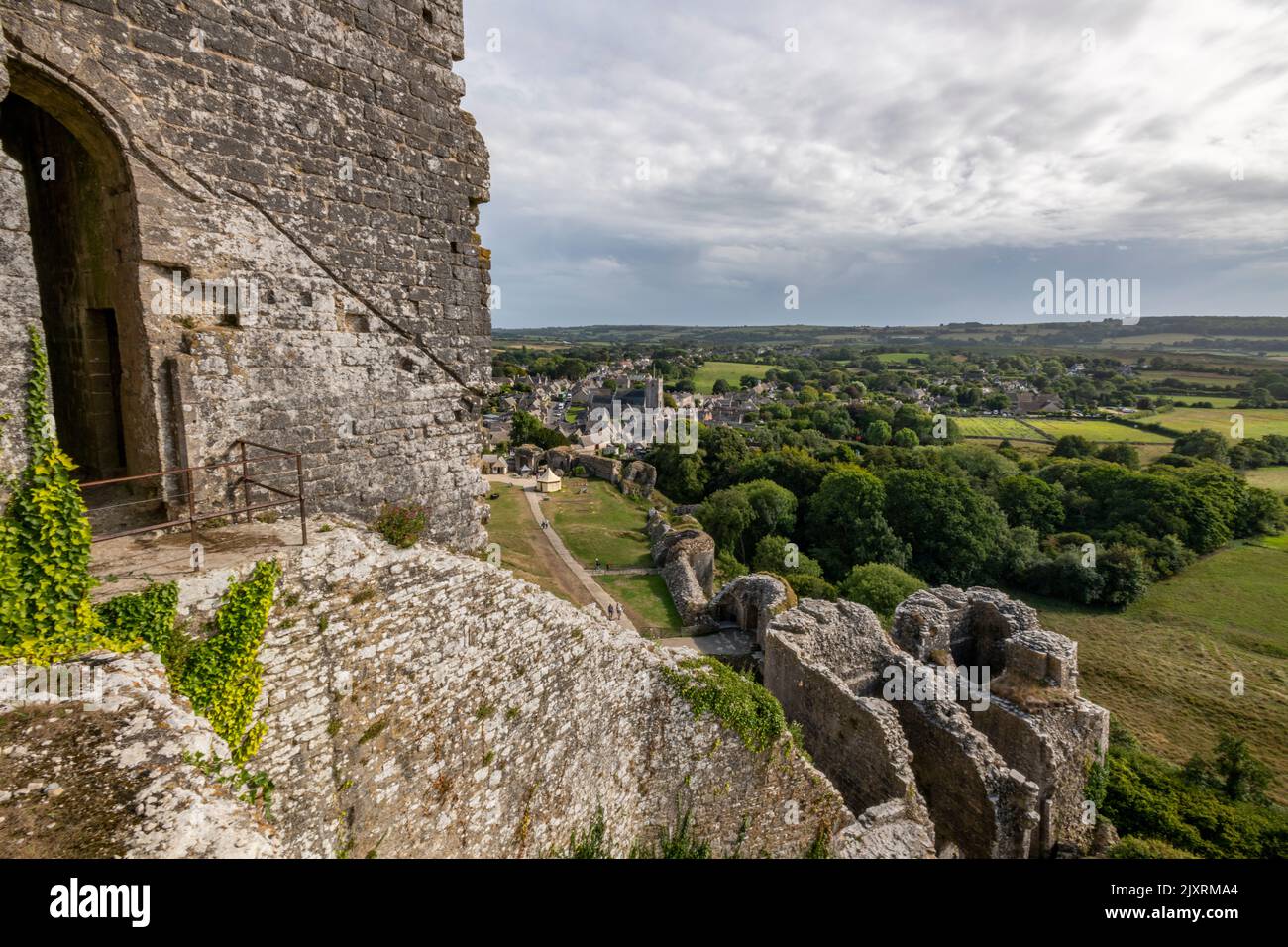 view of the village at corfe castle on the isle of purbeck in dorset uk, medieval castle at corfe in dorset, ruined castle in dorset, castle ruins. Stock Photo