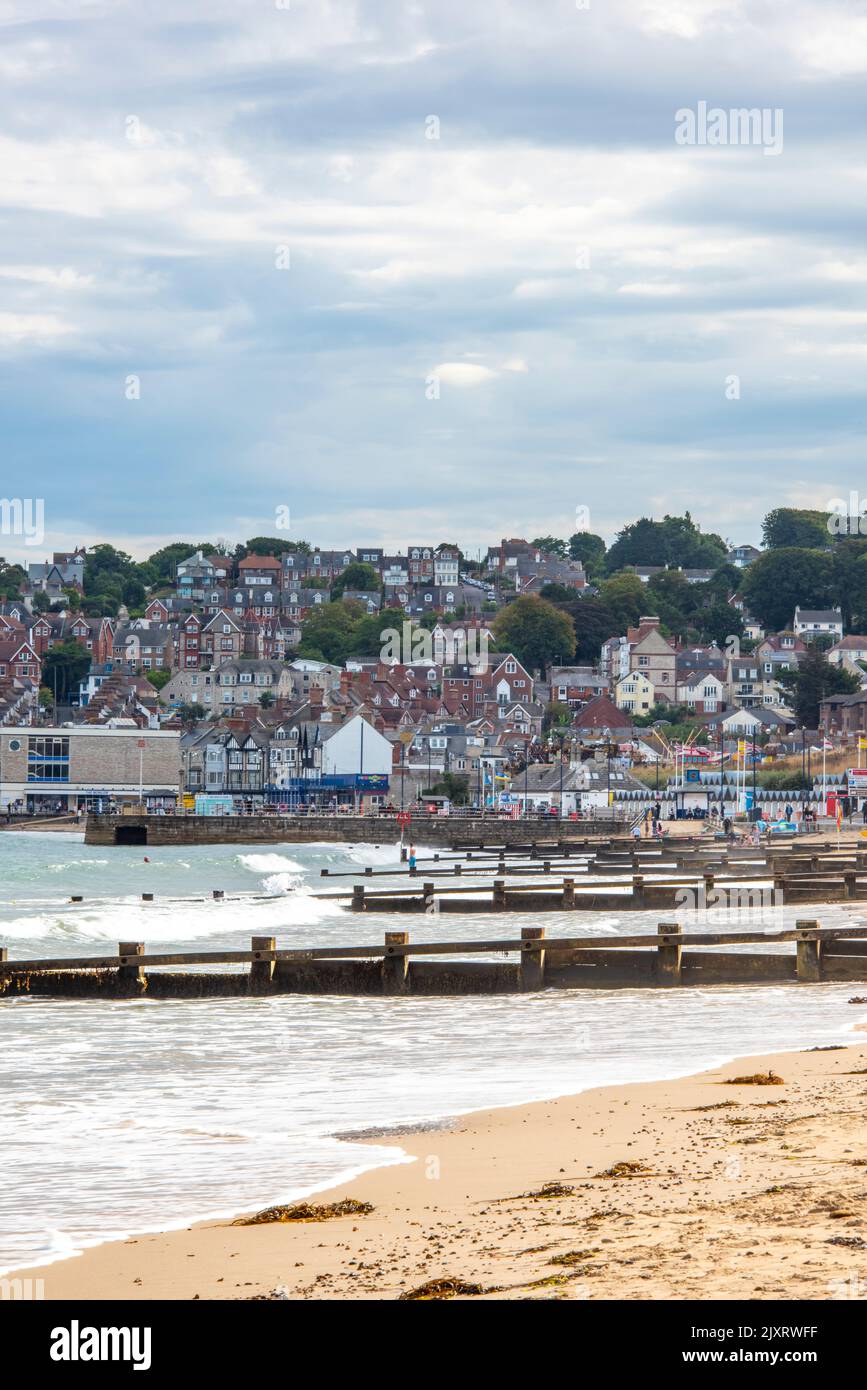 swanage beach on the isle of purbeck on the dorset coast, seaside and breakwaters on the sandy beach at swanage in dorset, isle of purbeck, dorset. Stock Photo