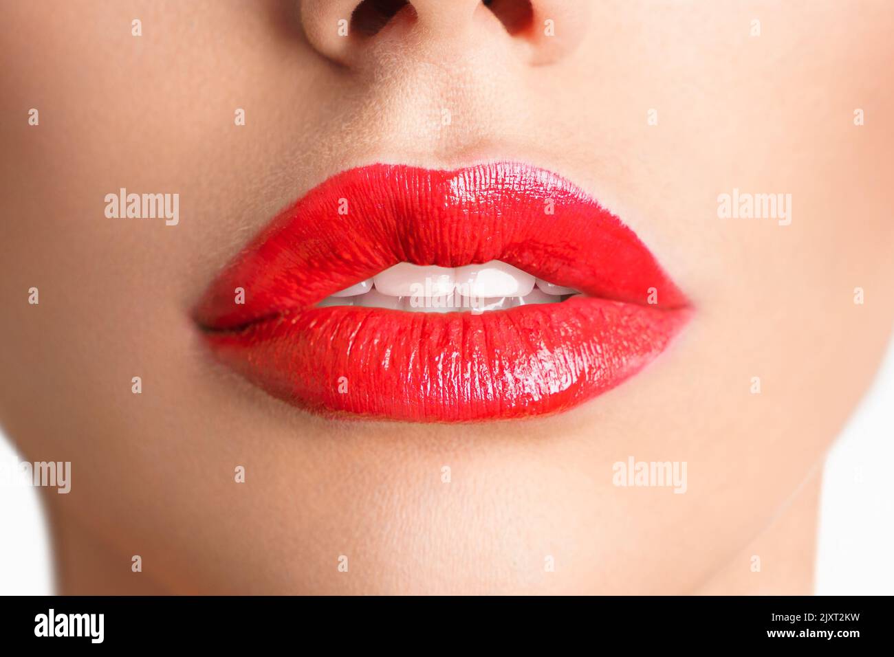 Close-up Beautiful lips. Sexy plump lips which red lipstick. Stock Photo