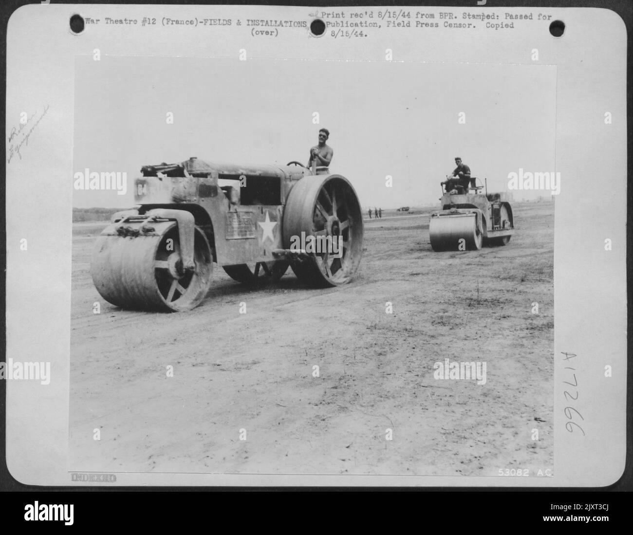 France-Smooth-wheel rollers run the length of the runway over and over again, gradually packing the surface until it is smooth and hard. These rollers, weighting ten tons each, are responsible for the finished surface which airplanes need for a Stock Photo