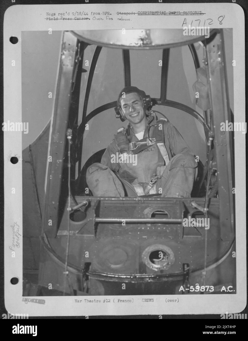 FRANCE-Lt. Edward Kespel of Chicago, Ill., radar observer of the P-61 Black Widow, a 9th Air force night fighter 'Borrowed Time,' is in the rear cockpit of his plane as it is ready to go on a mission in the everlasting crushing of the German forces. Stock Photo