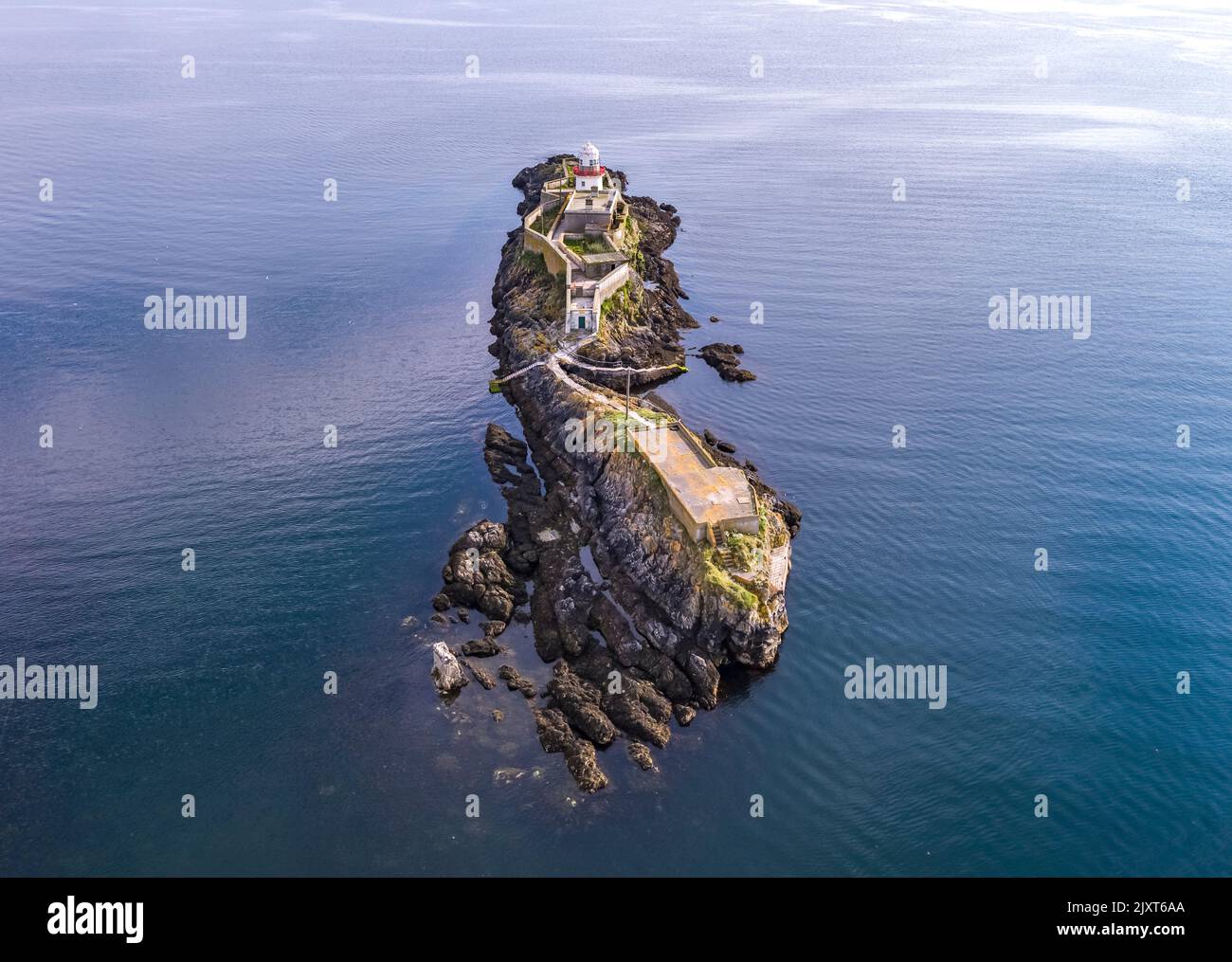 Aerial of the Rotten Island Lighthouse with Killybegs in background - County Donegal - Ireland. Stock Photo