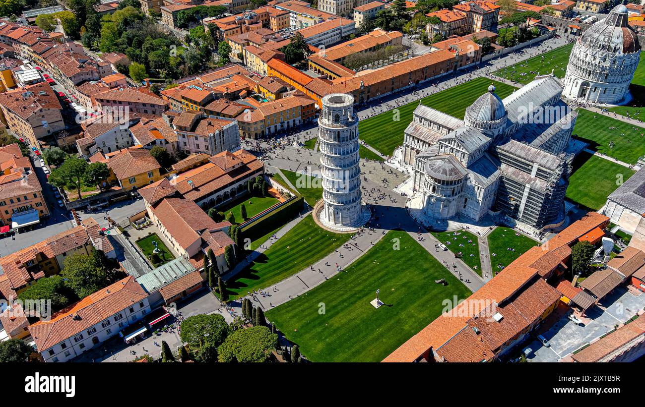 APRIL 13, 2022, Pisa, Italy : Panoramic aerial view of Leaning Tower of Pisa in Italy, Tuscany. Flying along Pisa Cathedral drone video Stock Photo