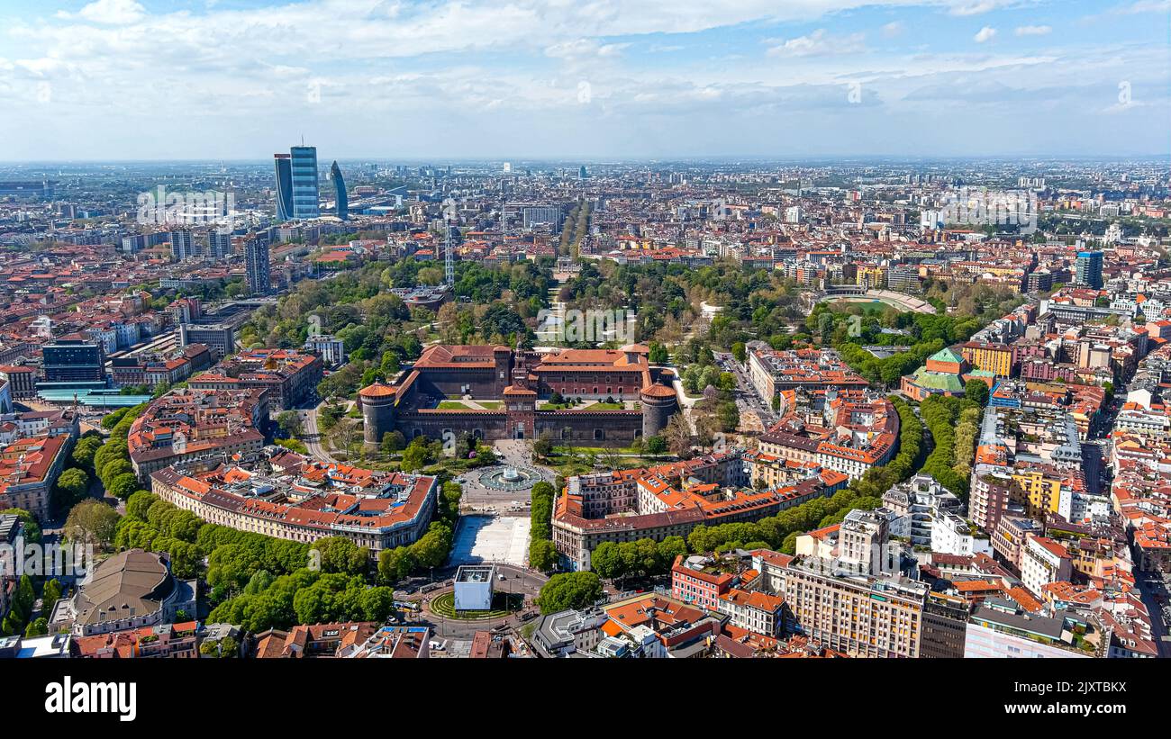 Aerial view of The Castello Sforzesco medieval fortification located in Milan, northern Italy. Flying around Sforzesco Castle citadel in Sempione Park Stock Photo