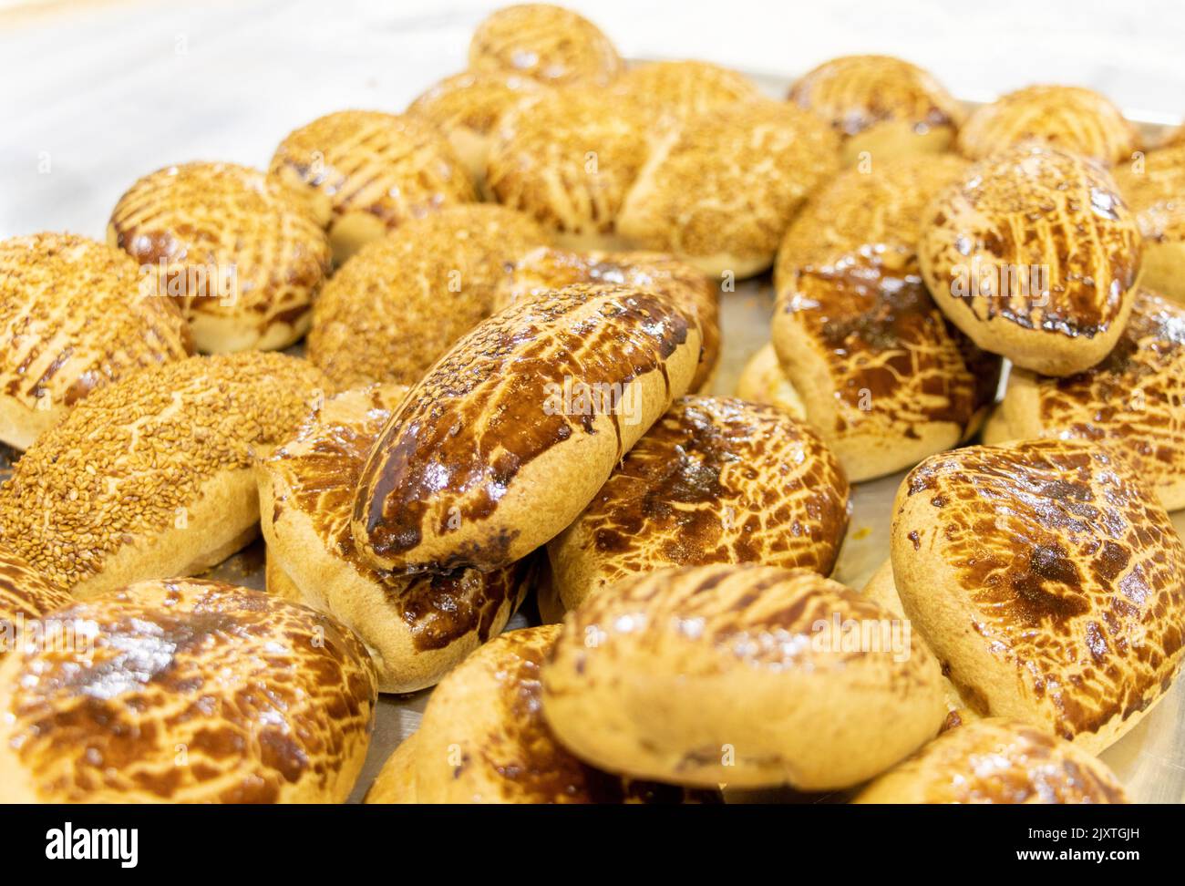 Hot and fresh pastry in a tray. Turkish name: Pogaca Stock Photo