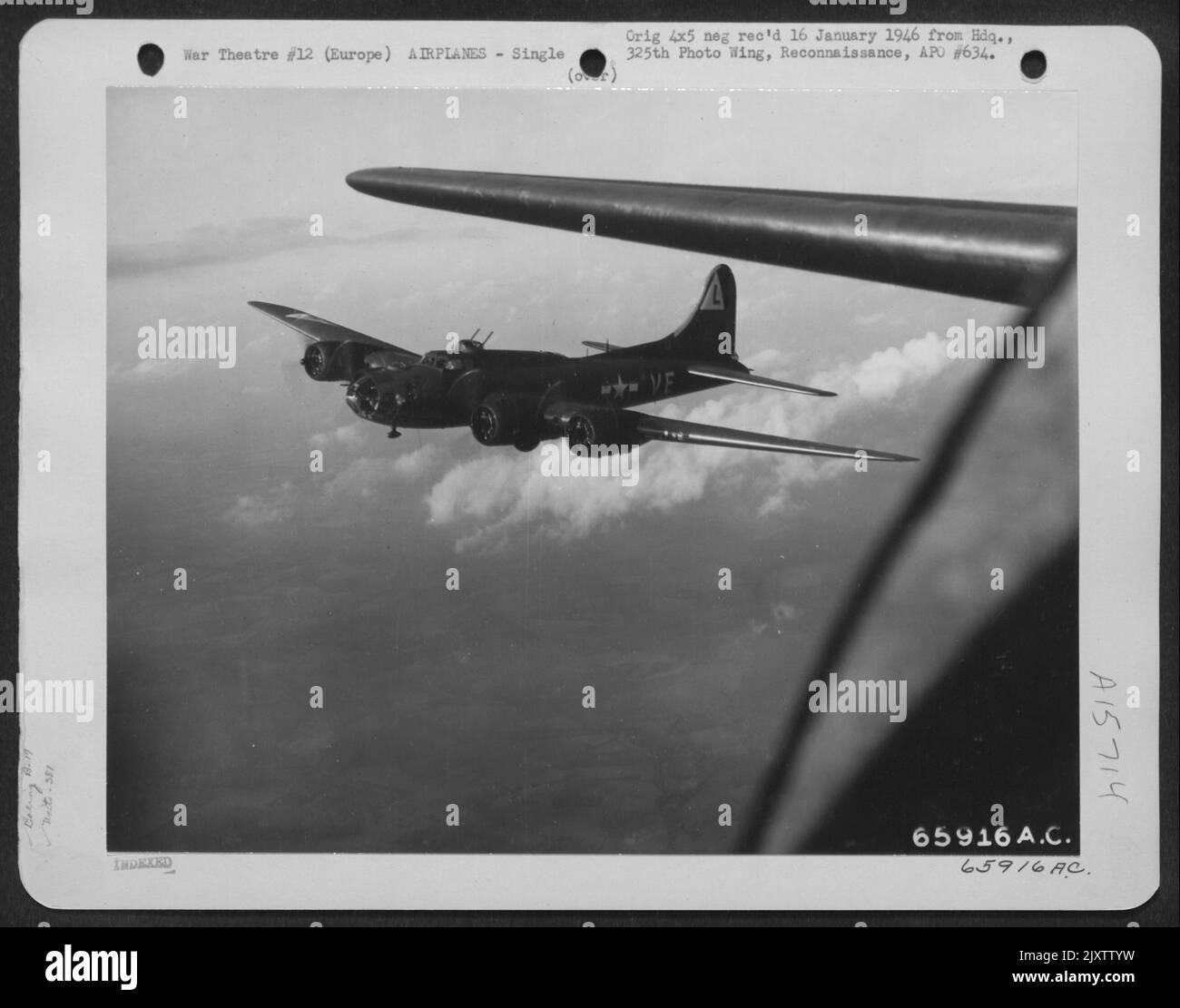 Framed By The Wing Of A Sister Plane, A Boeing B-17 'Flying Fortress' Of The 381St Bomb Group Presents A Pretty Picture As It Drones On Toward The Target In Europe. Stock Photo