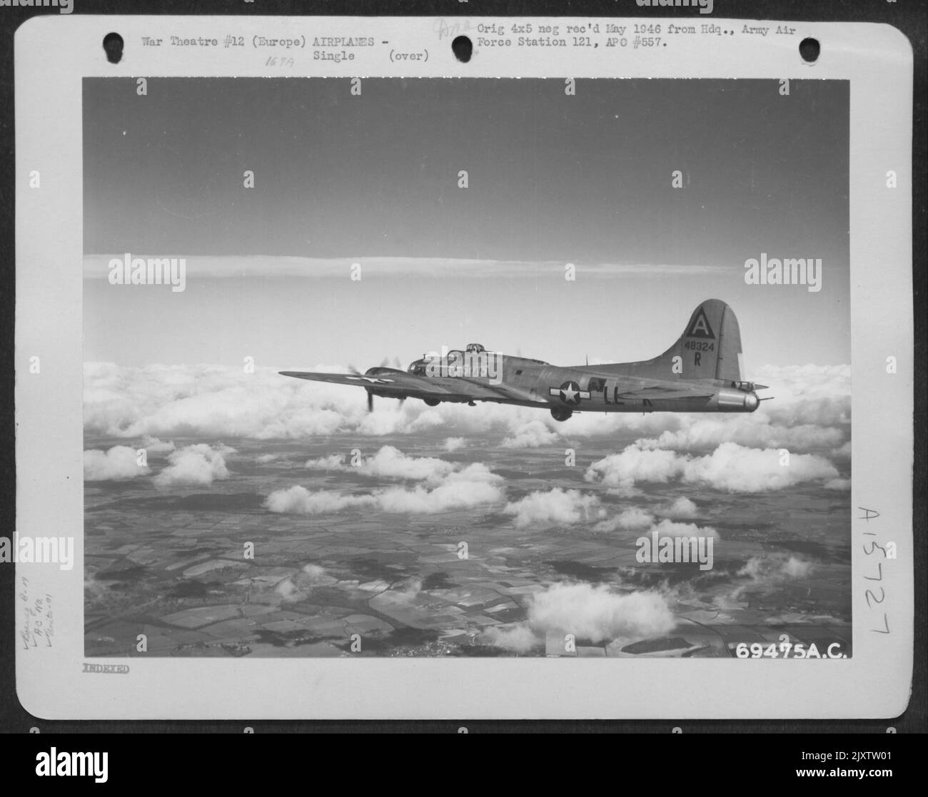 Boeing B-17 'Flying Fortress' (A/C No. 48324) Of The 91St Bomb Group Drones Over Fleecy Clouds Enroute To Bomb Nazi Installations In Europe. Stock Photo