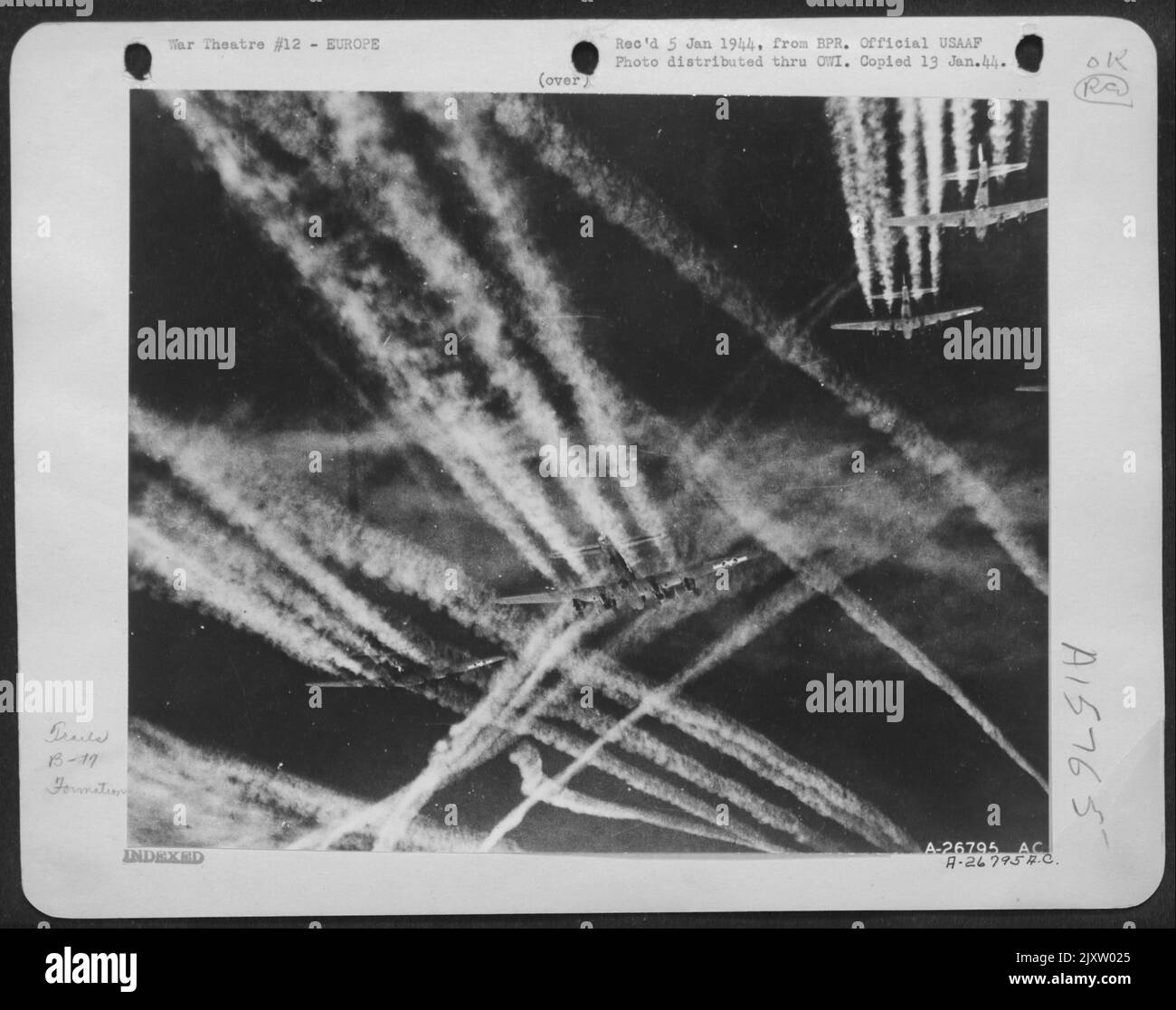 GHOST TRACKS:--ofrtresses of the Eighth Air force penetrating deep into skies over enemy occupied territory shown leaving tell tale condensation trails in their wake. Although these vapor etchings may satisfy the esthetic sense, they are usually Stock Photo