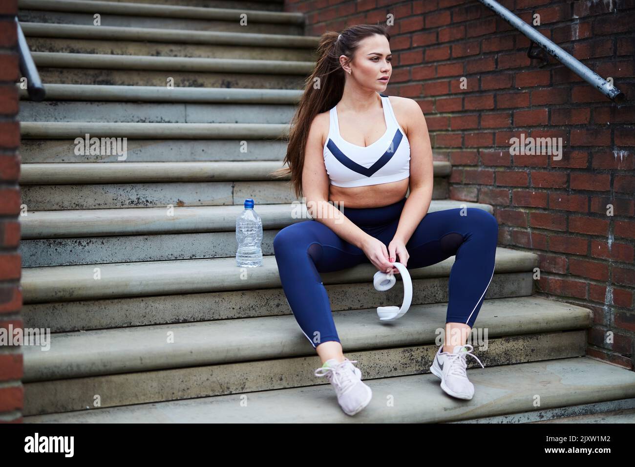 A single female jogger on the streets of Manchester, UK Stock Photo Alamy