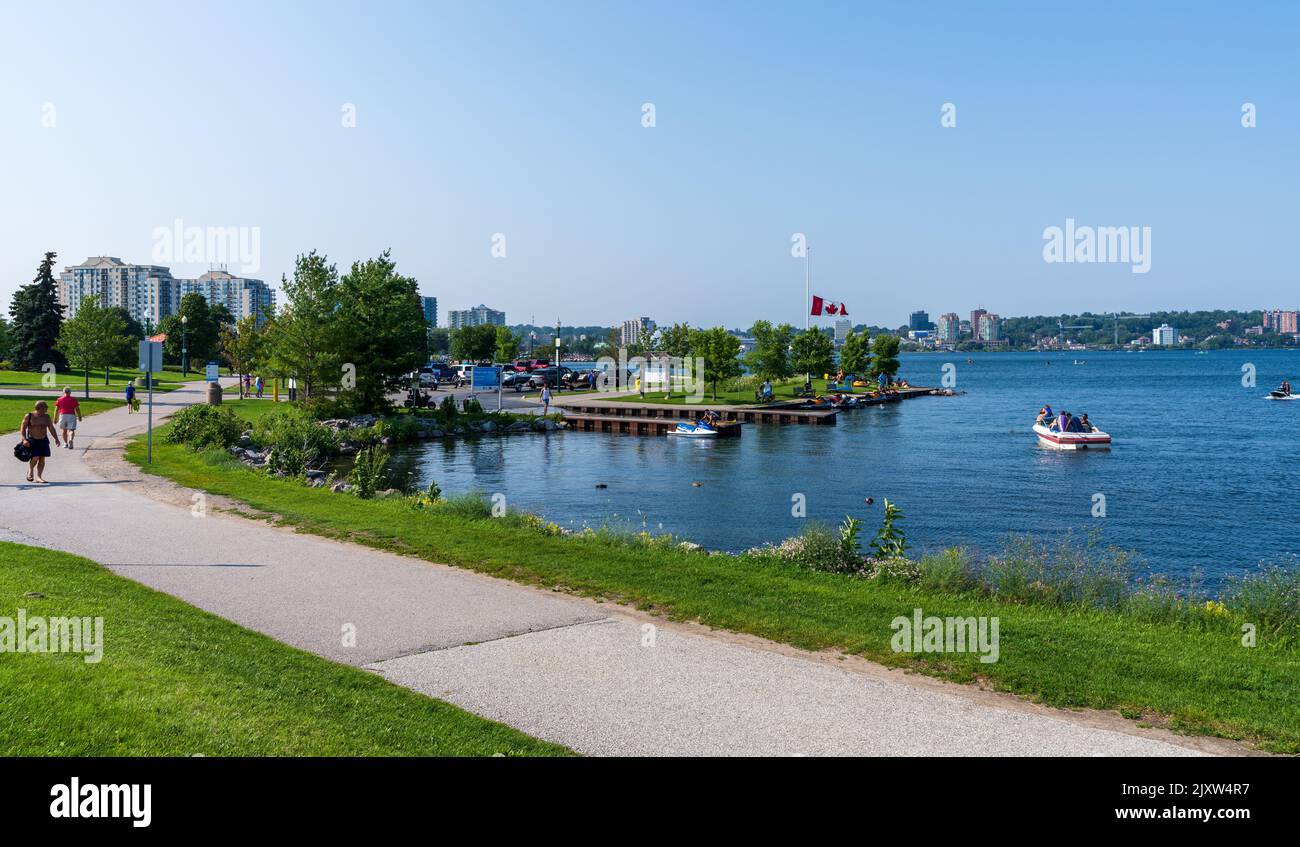 Barrie, Ontario, Canada - July 25 2021 : Walking Path on shore of Kempenfelt Bay, Lake Simcoe. Allandale Station Park in summer time. Stock Photo