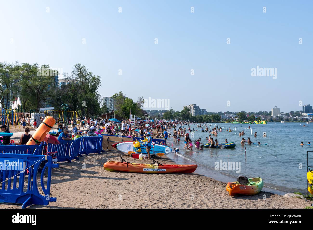 People doing leisure activities on the Centennial Park Beach in summer time. Kempenfelt Bay, Lake Simcoe. Barrie Waterfront Festival. Splash ON Water Stock Photo