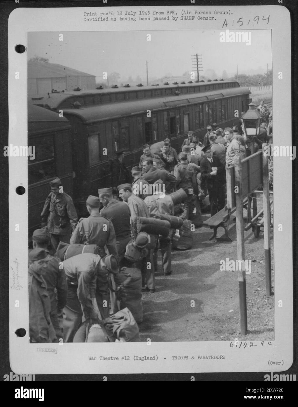 On The Platform, The Train Guard, Ticket Collector And A U.S. Transportation Corpsman Shepherd The Men And Their Bulky Equipment Aboard. This Is One Journey They Will All Agree Is 'Really Necessary'. This Train Will Take Them To Greenock, Scotland, Wher Stock Photo