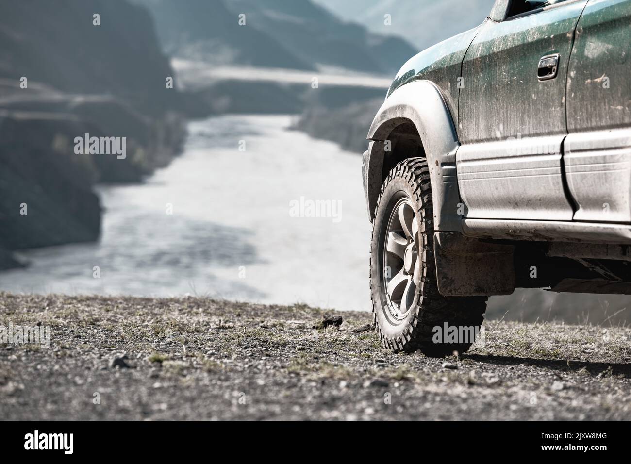 Close up photo of 4x4 offroad ready car at mountain river Stock Photo
