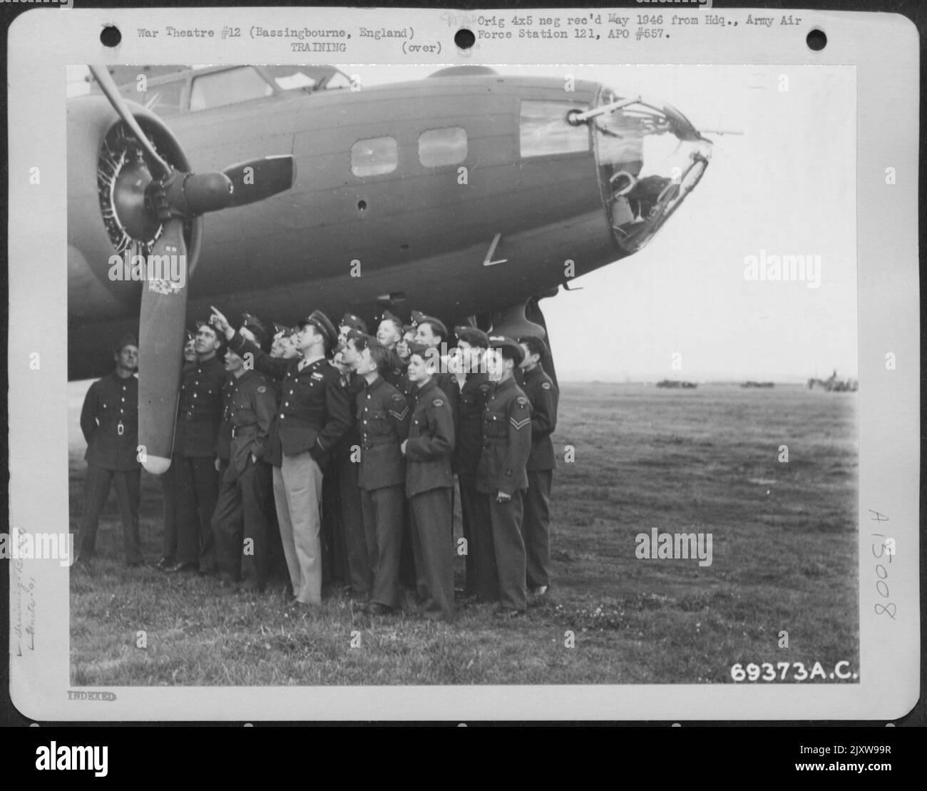 A Group Of Raf Cadets Listen Attentively As An Air Force Officer Points Out The Features Of A Boeing B-17 'Flying Fortress' At The 91St Bomb Group Base In Bassingbourne, England. 16 June 1943. Stock Photo
