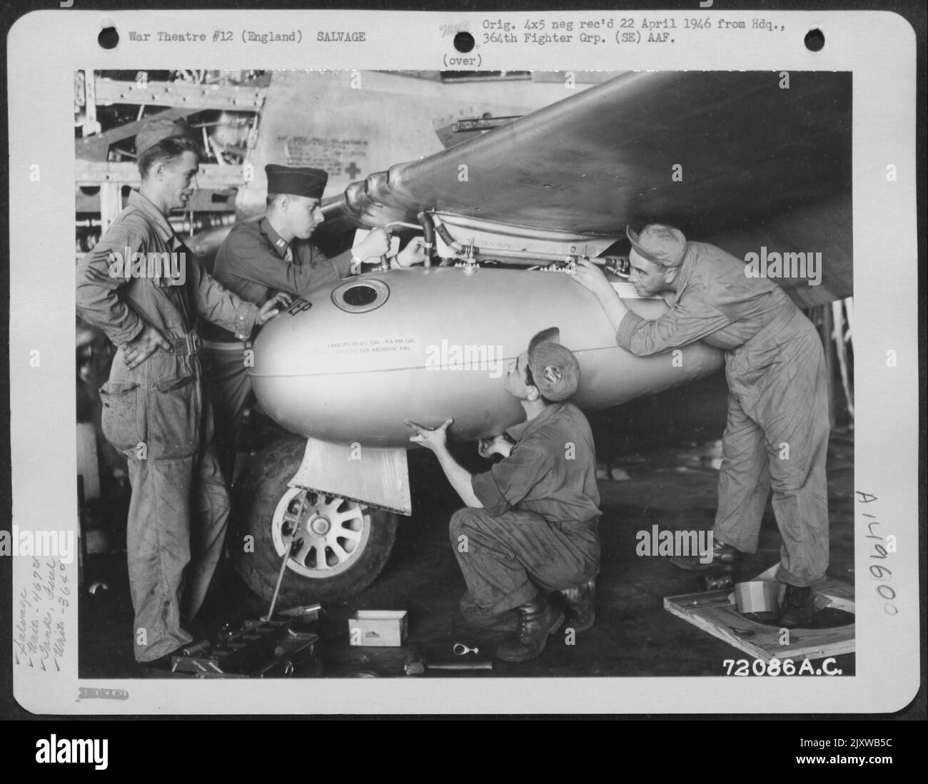 Men Of The 467Th Service Squadron, Salvage A Fuel Tank From The Wing Of A North American P-51 Of The 364Th Fighter Group, 67Th Fighter Wing, At 8Th Air Force Station F-375, Honnington, England. 4 August 1944. Stock Photo