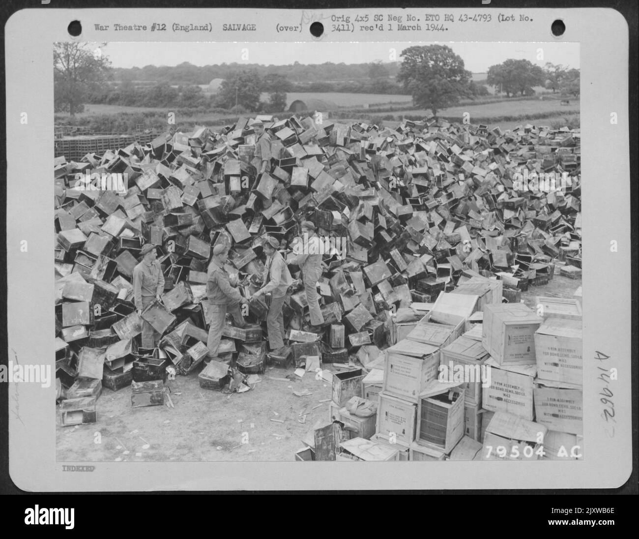Gi'S Pile Petrol Cans On A Salvage Dump At An 8Th Air Force Service Command Depot At Sharnbrook, England. 7 July 1943. Stock Photo
