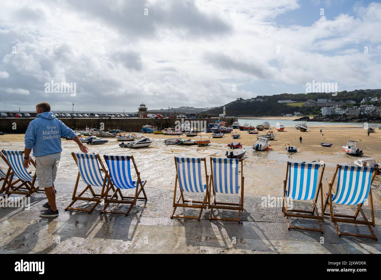 St Ives, Cornwall, UK. 7th Sep, 2022. UK Weather: Deckchairs were set out optimistically on the seafront at the picturesque seaside resort of St Ives as the heavy rain and thundery downpours passed over bringing a warm sunny spell. Credit: Celia McMahon/Alamy Live News Stock Photo
