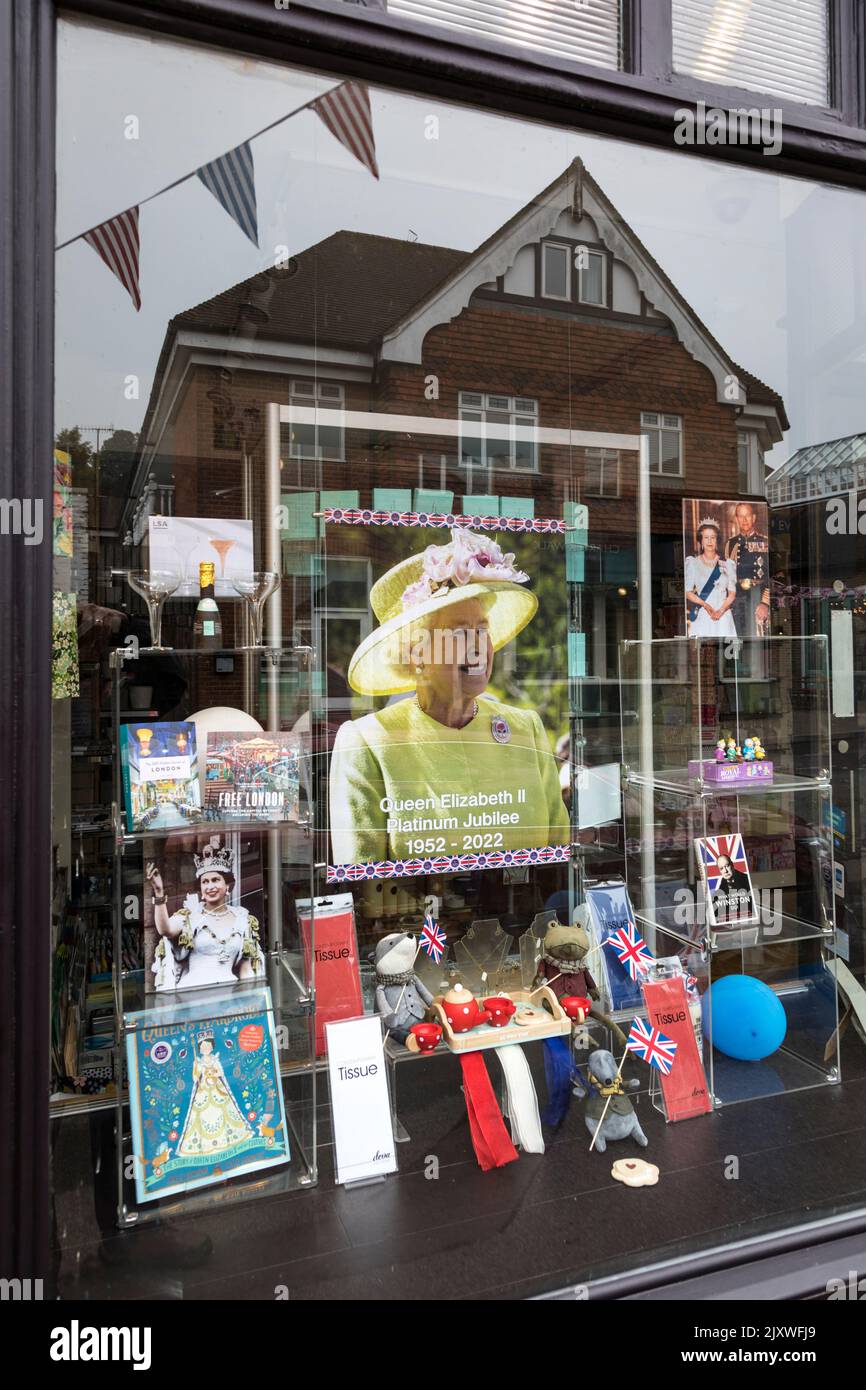 Shop window displaying memorabilia of the Queen in celebration of her Platinum jubilee. Stock Photo