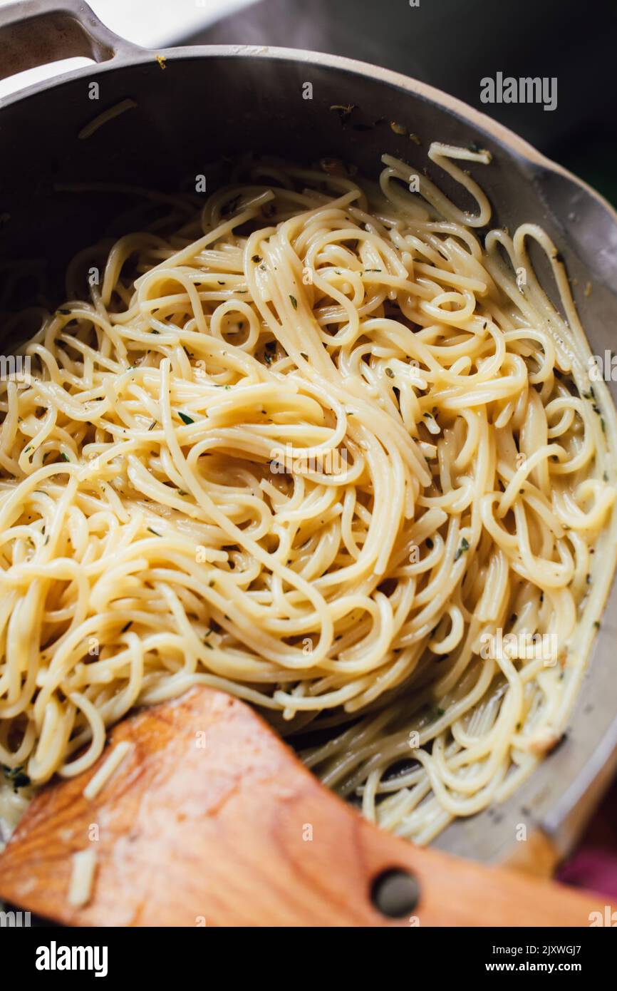 cooking freshly made Spaghetti pasta with thyme butter in Always pan