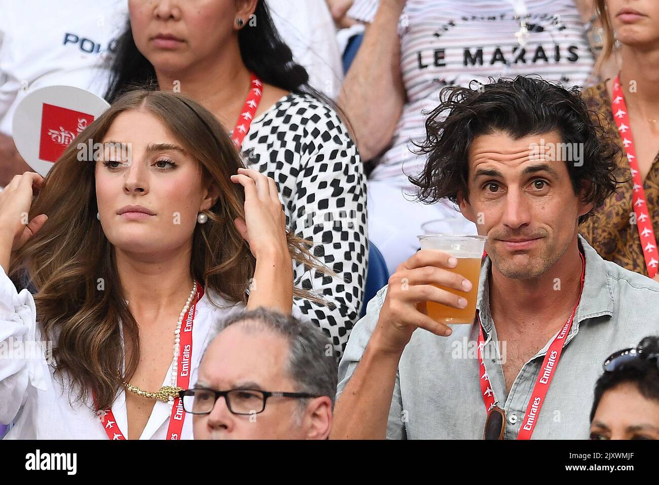 Australian radio personality Andy Lee (right) and girlfiend Rebecca Harding  are seen in the crowd during the men's singles semifinal match between  Stefanos Tsitsipas of Greece and Rafael Nadal of Spain on
