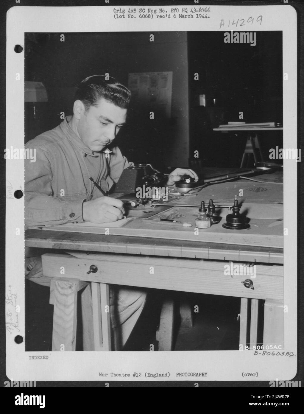 T/5 Elroy O. Bowers Of Cleveland, Ohio Is Shown Making Aerial Maps With