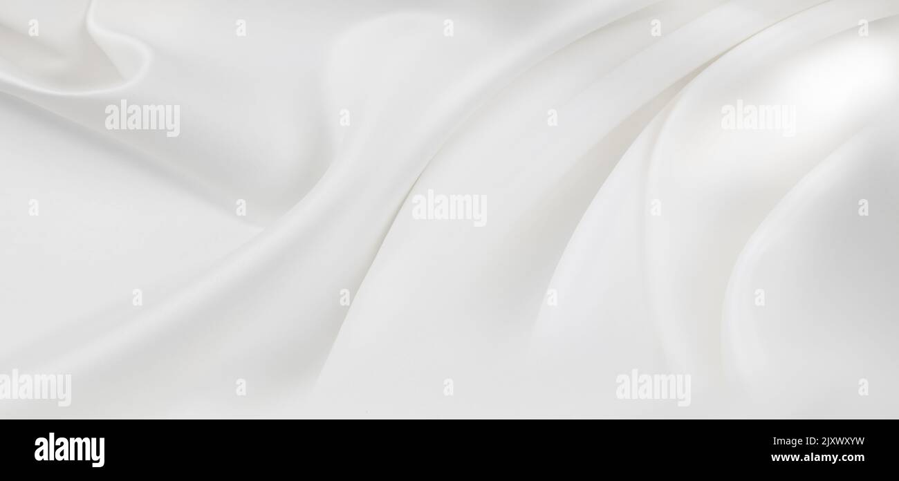 Close-up of rippled white silk fabric texture background Stock Photo