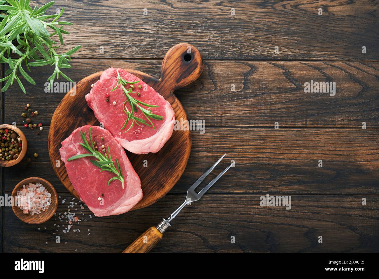 Mock Filet Steaks. Fresh Filet mignon Steaks with spices rosemary and pepper on ...