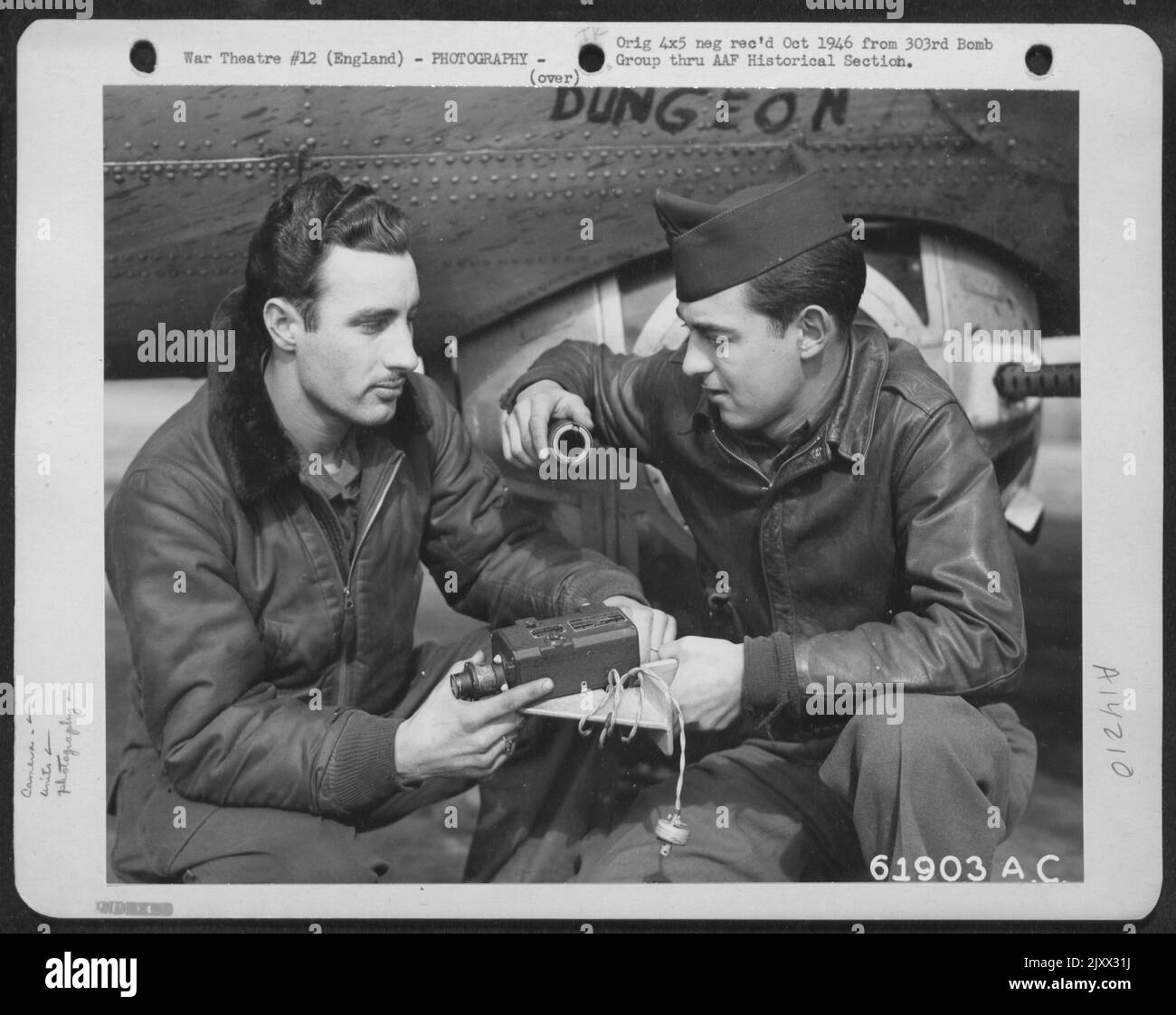 Crew Members Of The 303Rd Bomb Group Check The Machine Gun Camera Which