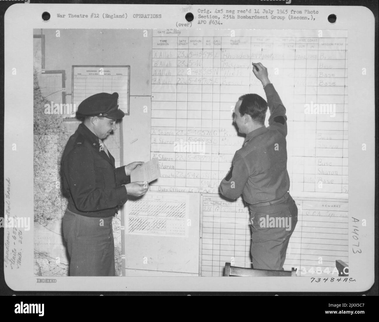 Members Of The 652Nd Weather Reconnaissance Squadron, 25Th Weather Reconnaissance Group, Mark Up Another Mission On The Status Board. England, 23 May 1945. Stock Photo