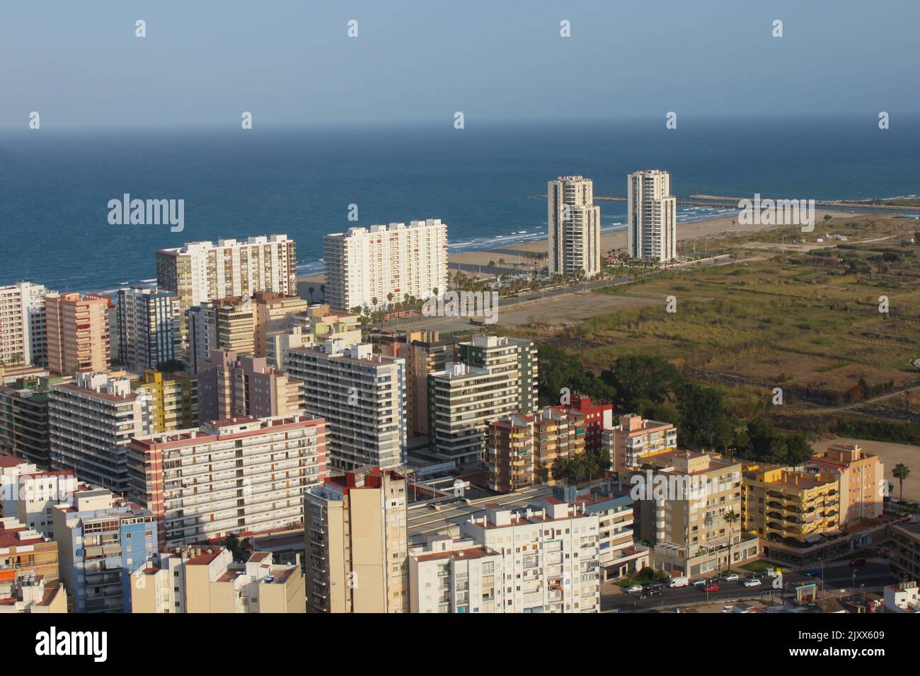 Cullera, Spain - 12 May 2014: Maritime outskirts of the resort city, top view. Residential buildings neighboring to agricultural land Stock Photo