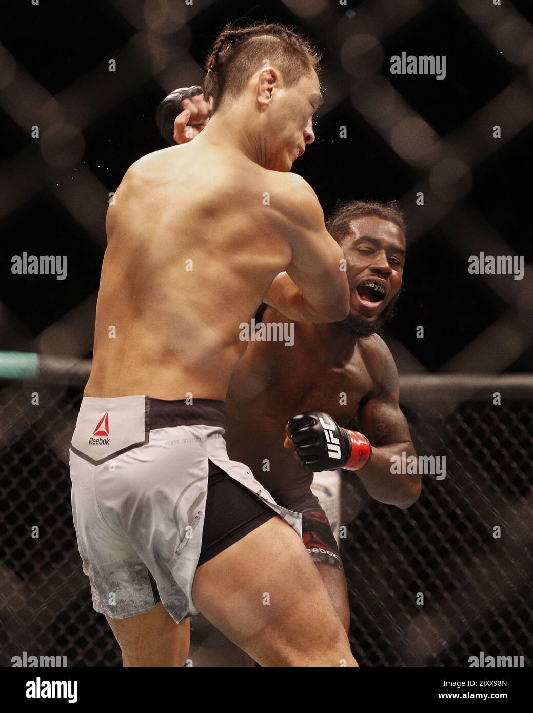 Devonte Smith (right) punches during the UFC 234 uLightweight Bout