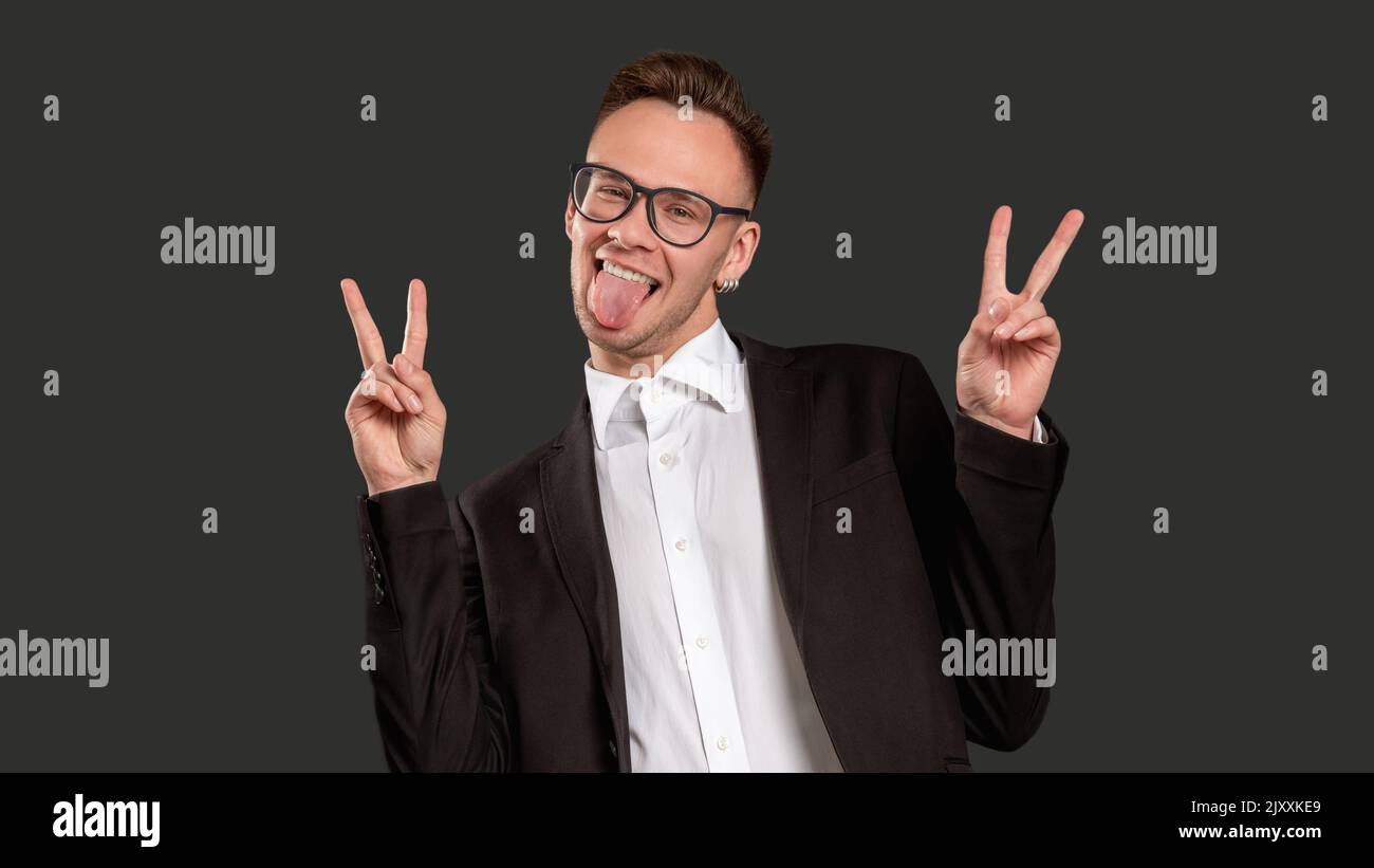 amused guy portrait fun lifestyle victory sign Stock Photo