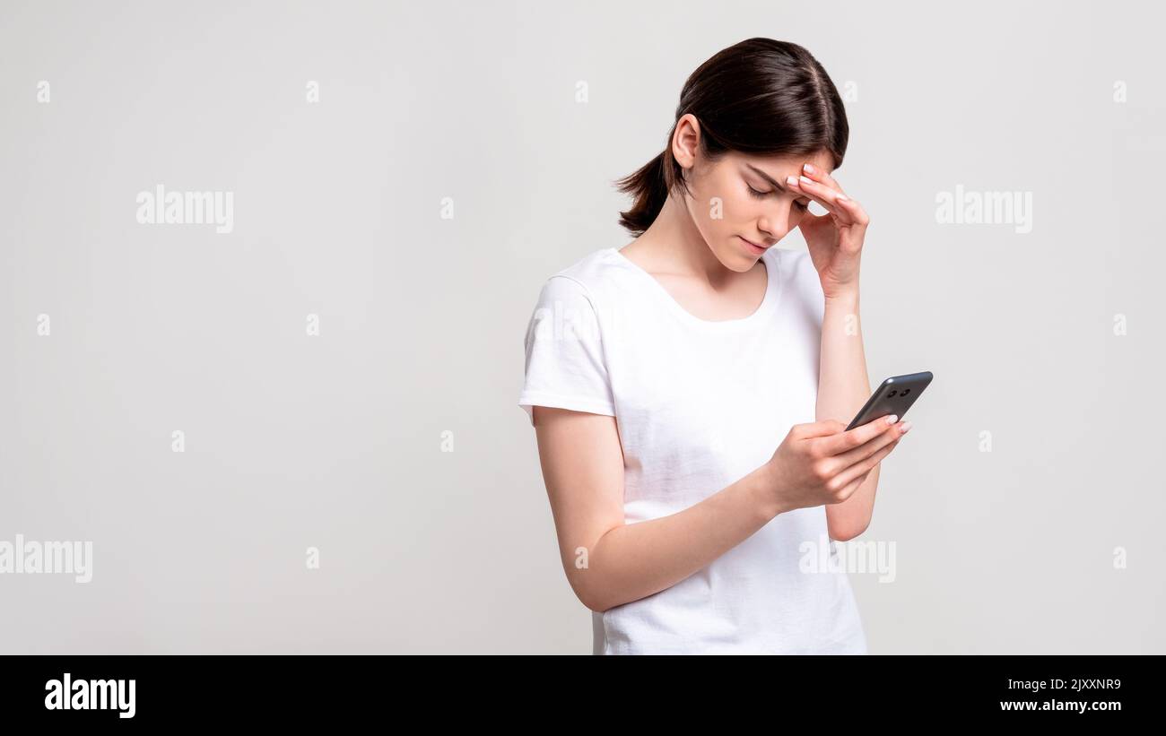 online conflict negative mobile chat woman phone Stock Photo
