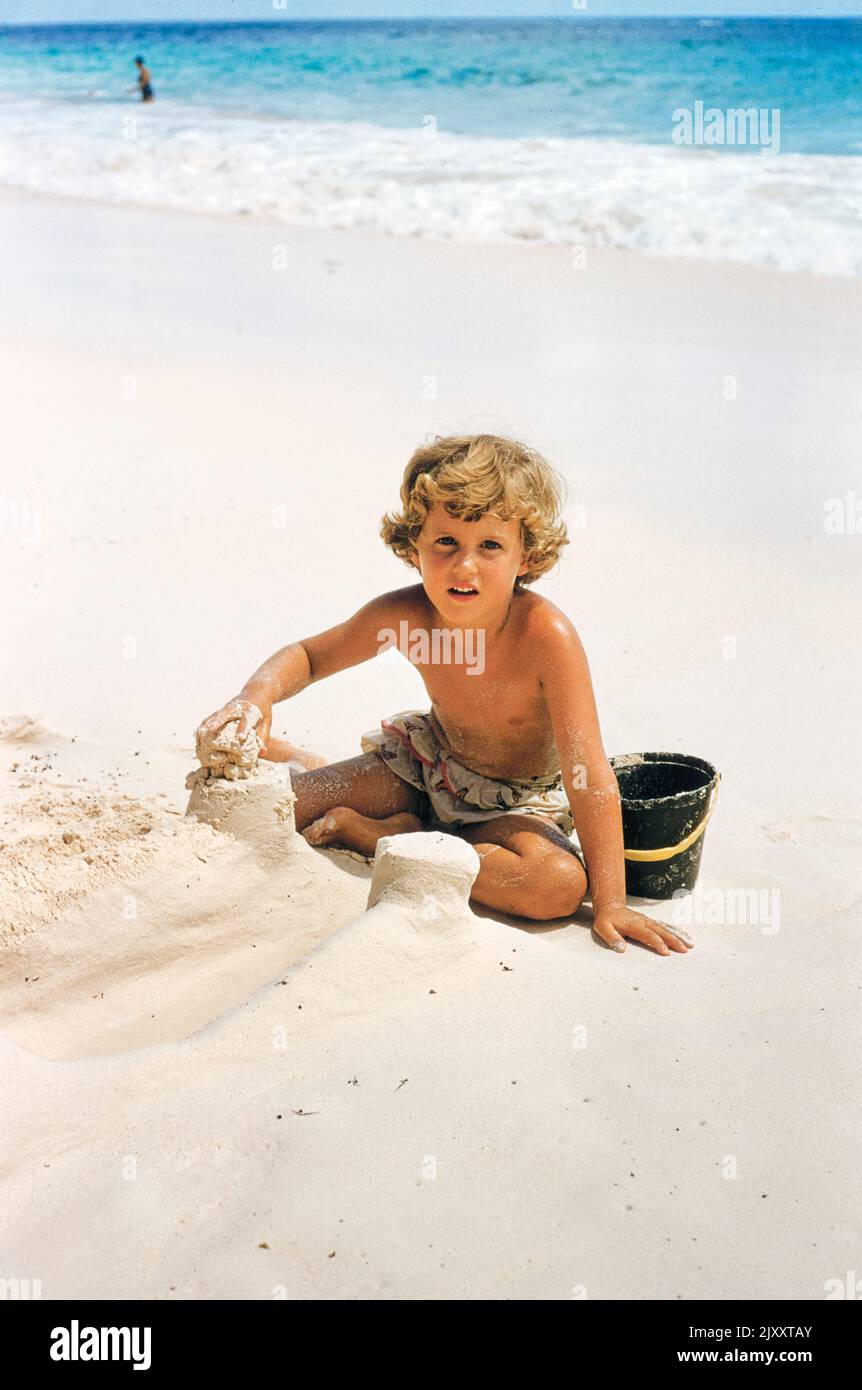 Young Boy building Sandcastles on Beach, Bermuda, Toni Frissell Collection, 1956 Stock Photo