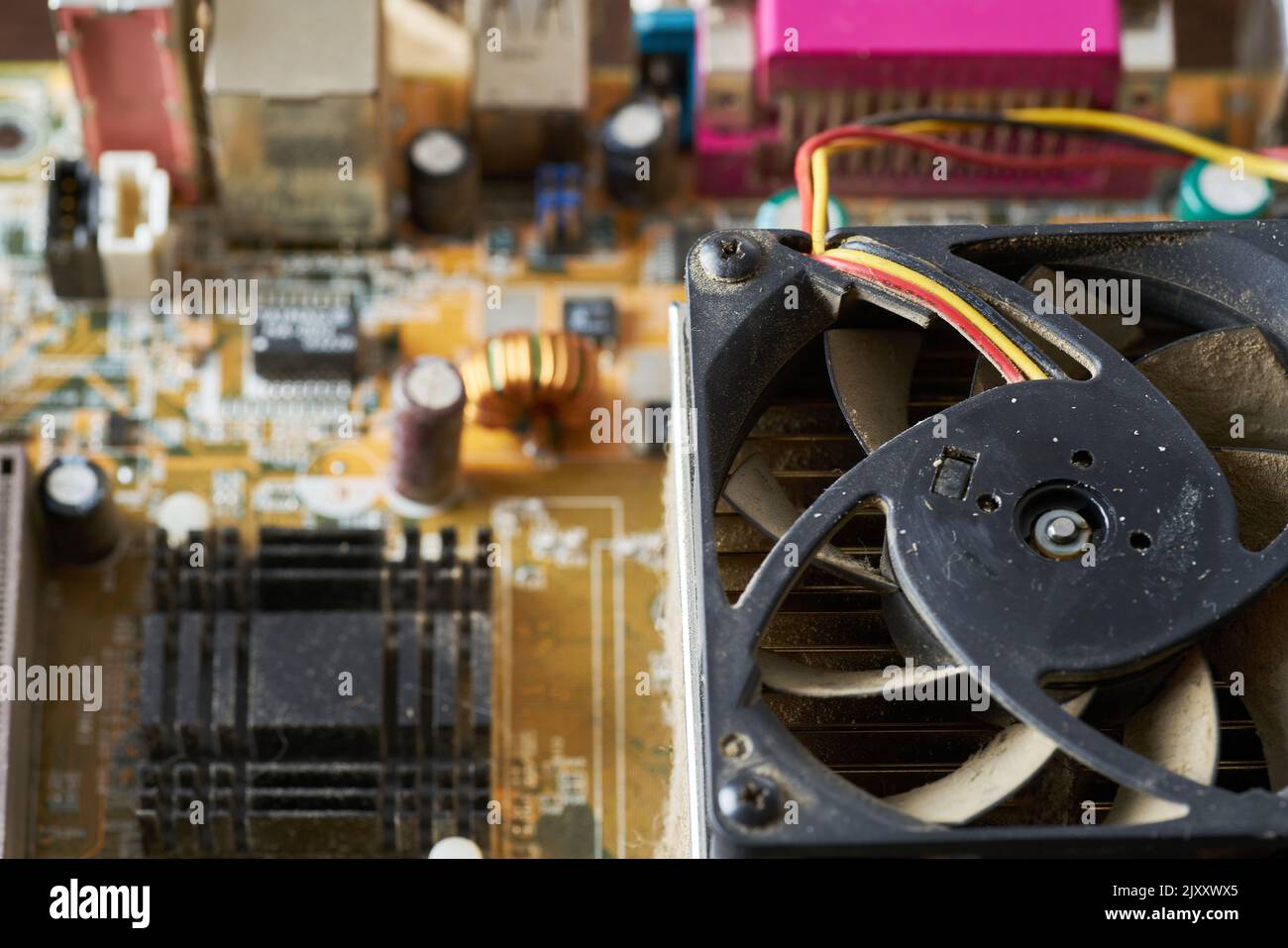 A thick layer of dust covers the internal electronic components of the