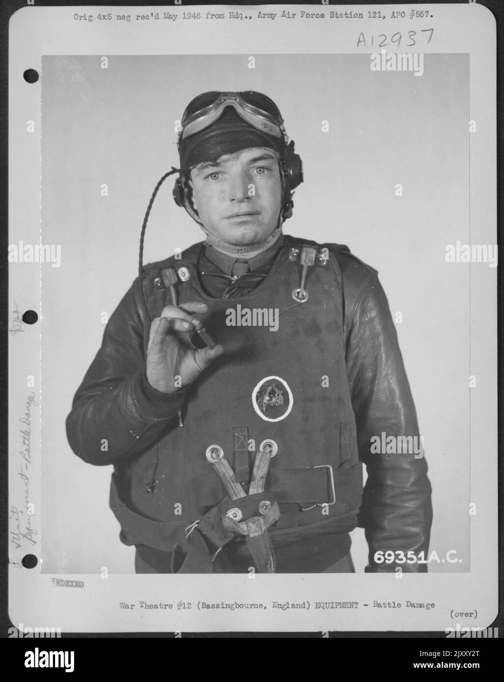 A Combat Crew Member Of The 91St Bomb Group, Wearing A Flak Vest, Holds