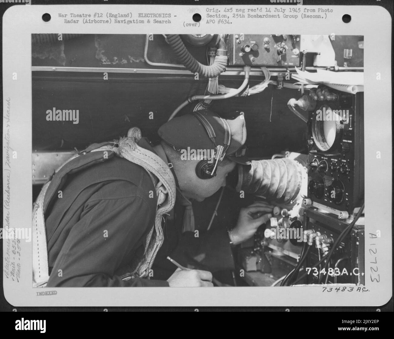 Navigator Of The 652Nd Weather Reconnaissance Squadron, 25Th Weather Reconnaissance Group, Operates A 'Gee' Box (Radar) Aboard A Boeing B-17 Flying Fortress. England, 23 May 1945. Stock Photo