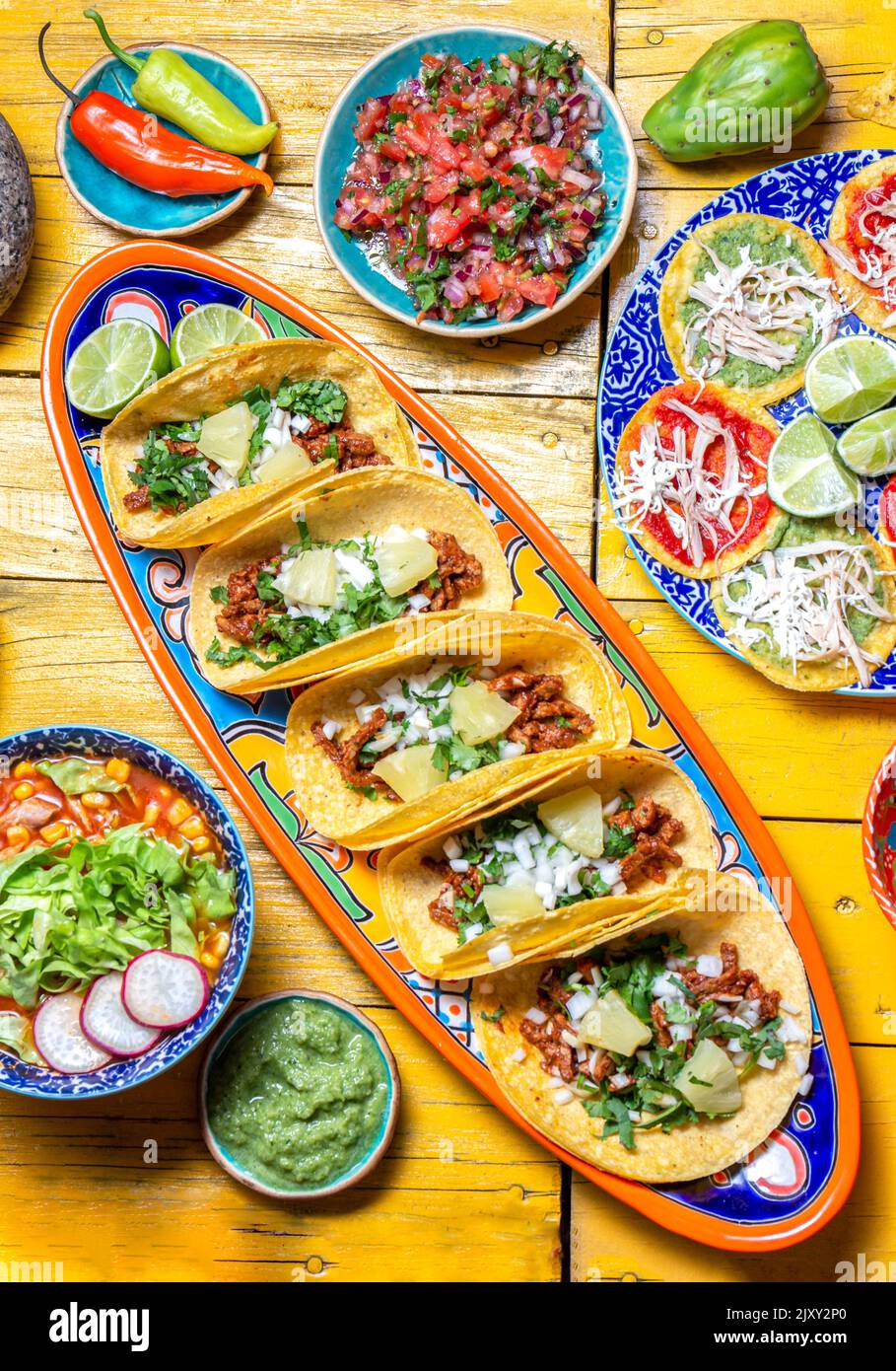Mexican festive food for independence day - independencia chiles en nogada, tacos al pastor, chalupas pozole, tamales, chicken with mole poblano sauce Stock Photo