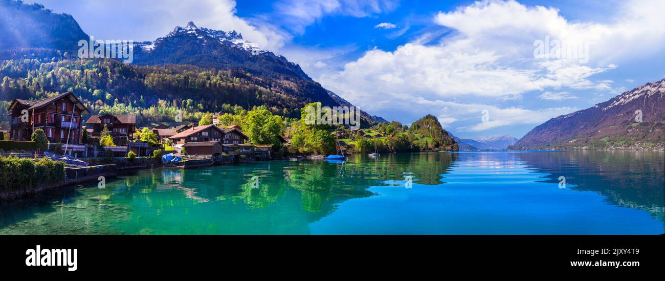 Stunning idylic nature scenery of mountain lake Brienz. Switzerland, Bern canton. Iseltwald village surrounded turquoise waters Stock Photo