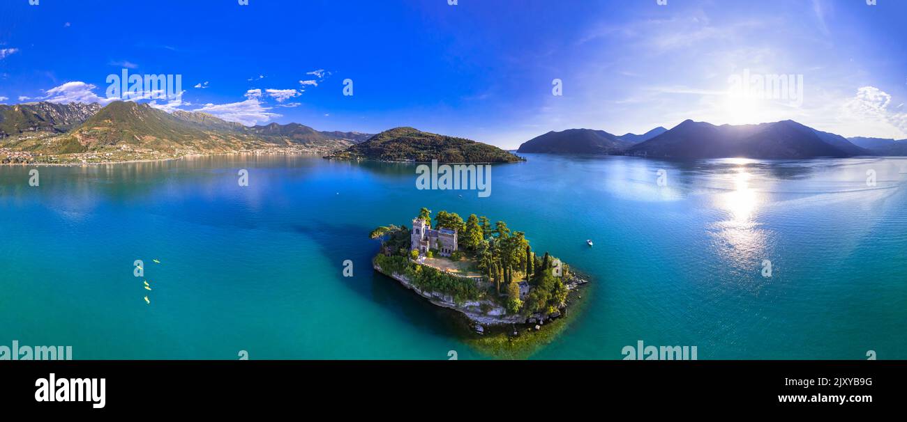 Amazing lake Iseo scenery with picturesque small island Loreto with castle, aerial drone view. Italy, Brescia province Stock Photo