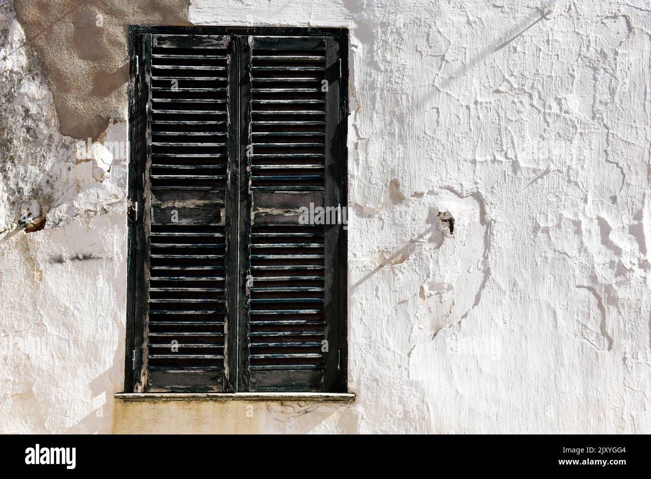 Urban abstract of building with shuttered window and wall with copy space on architecture Stock Photo