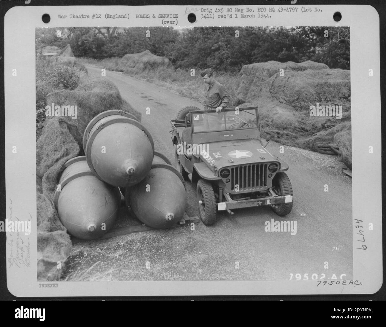This Jeep Shows The Comparative Size Of 4000-Pound Block Busters At An 8Th Air Force Service Command Depot In Sharnbrook, England. Sgt. Dow Flint Of St. Petersburg, Florida Is Driver Of The Jeep. 7 July 1943. Stock Photo