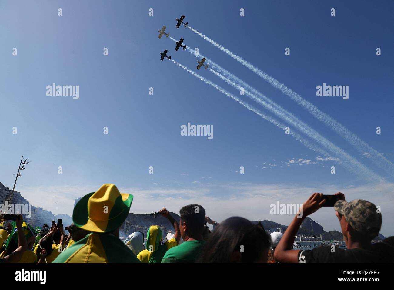 Aircrafts fly over Copacabana beach as people take part in the Independence Day celebrations, in Rio de Janeiro, Brazil September 7, 2022. REUTERS/Pilar Olivares Stock Photo