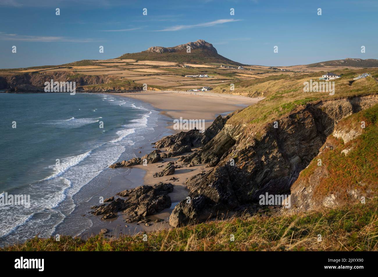 Whitesands Bay and Carn Llidi hill near St David's City in West Wales, a surfing destination with a shop and cafe. Stock Photo