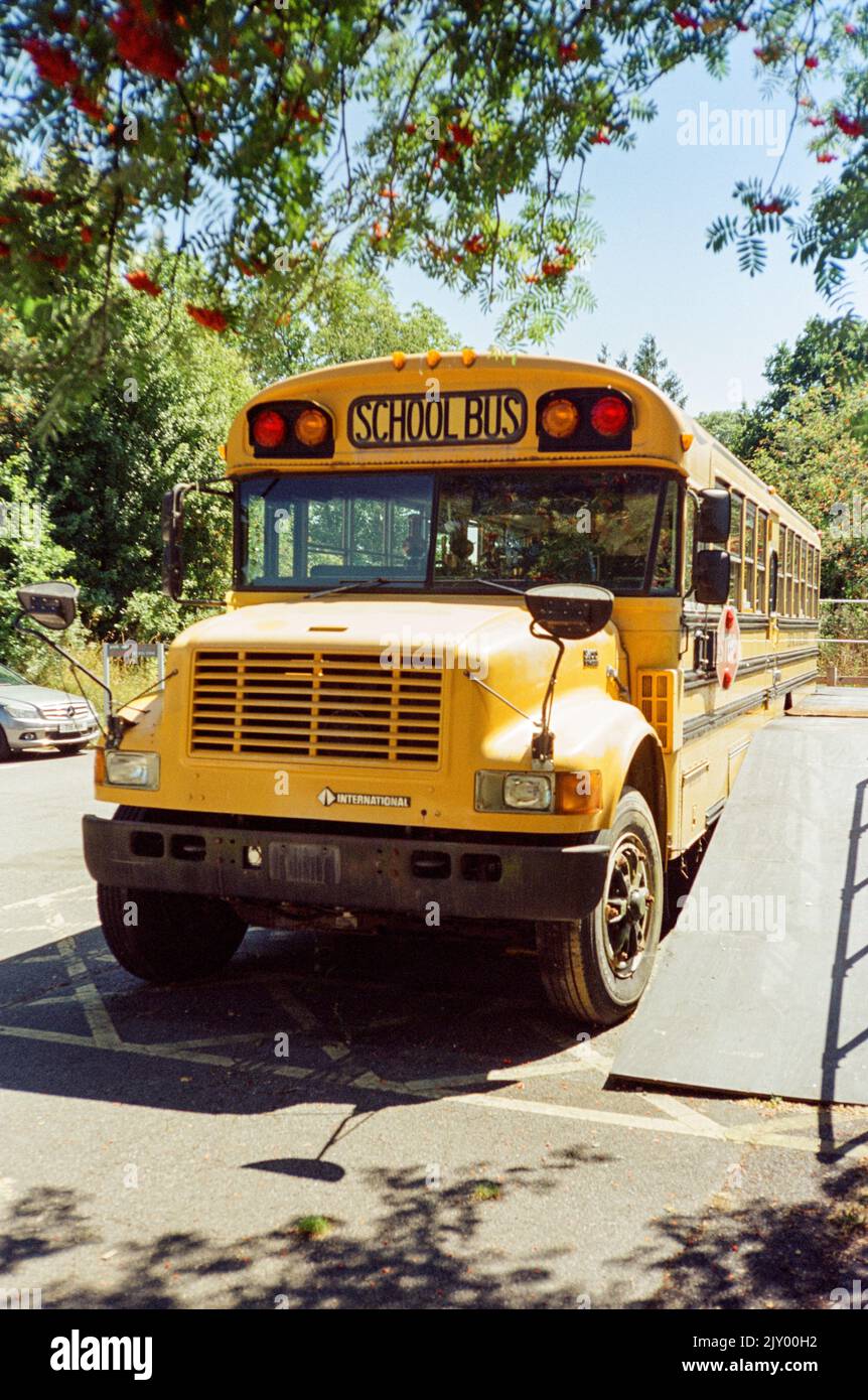 Yellow American school bus converted into a rum distillery, Dartington