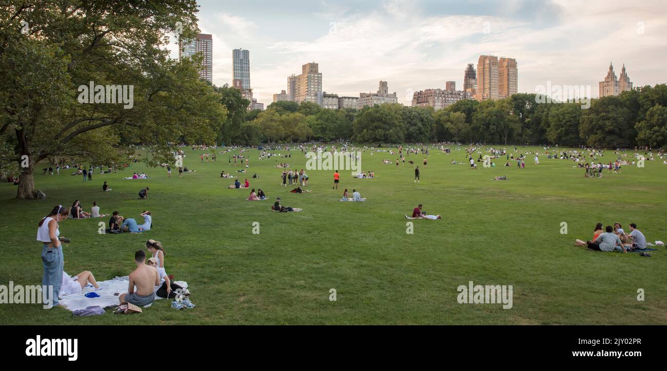 People in Central  Park, Manhattan, New York City, USA at the end of a summer day Stock Photo