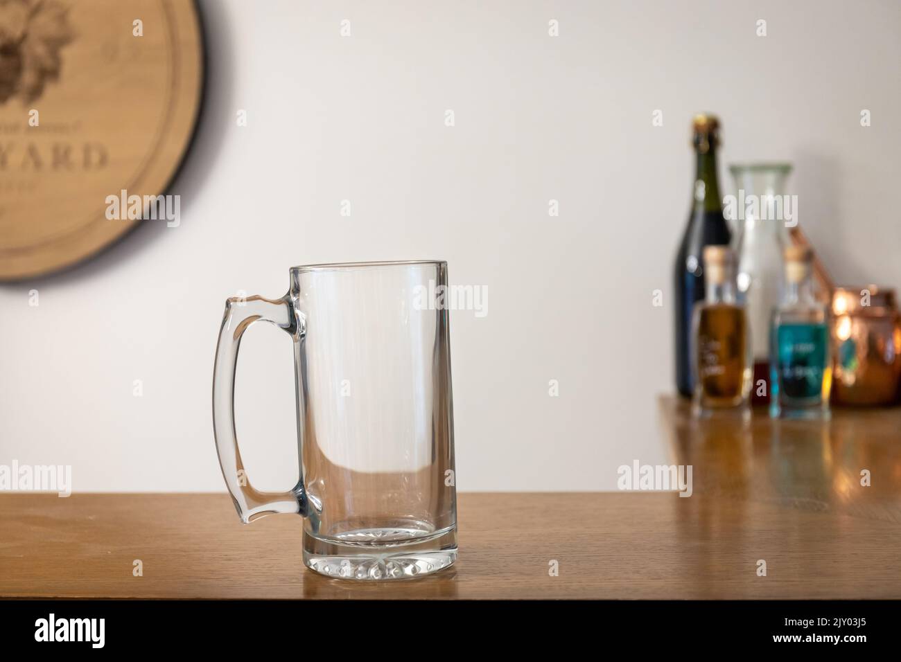 Empty Beer Stein Glass on Wooden Bar Stock Photo